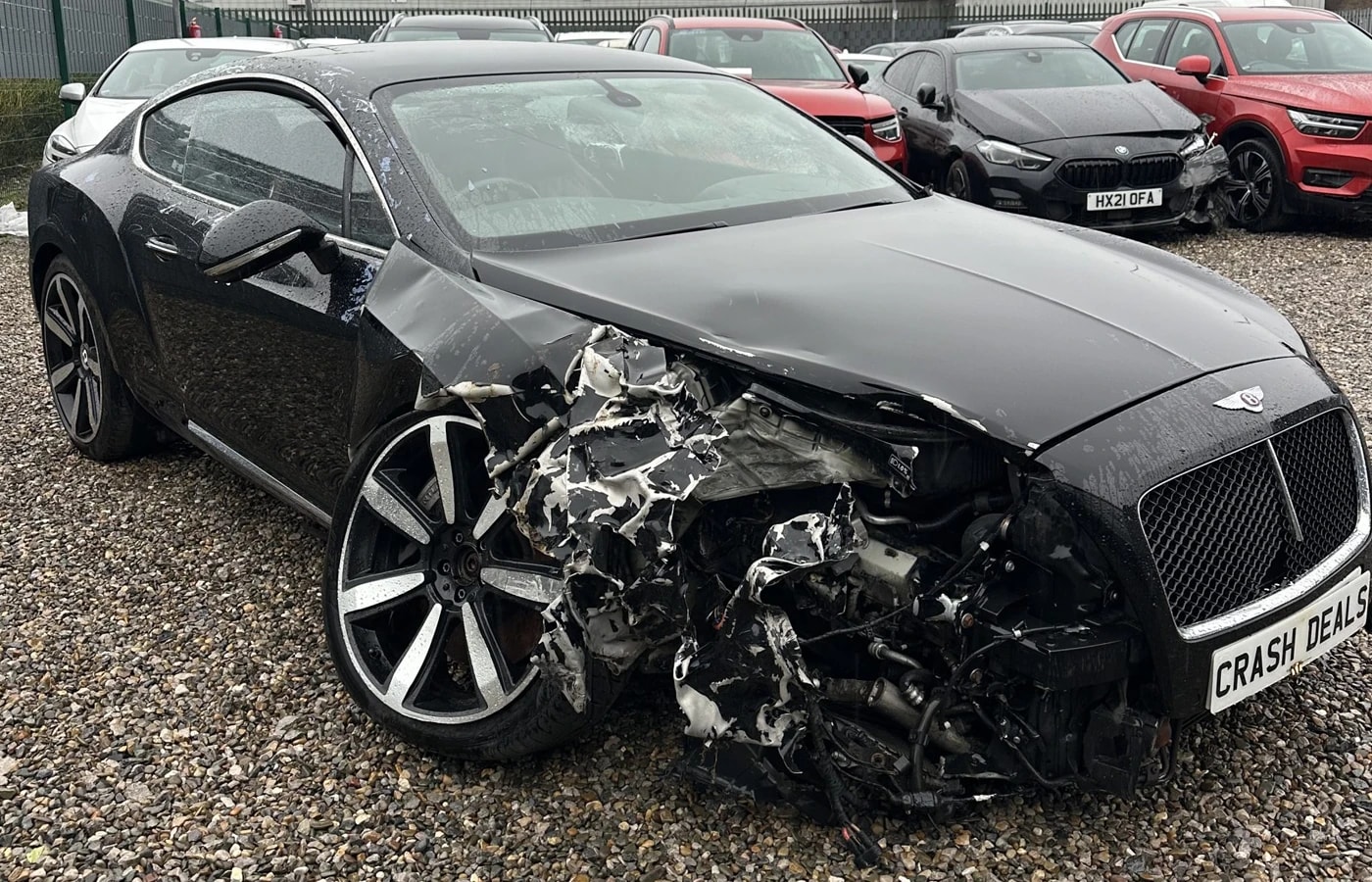 Damaged Bentley Continental GT with front-end collision damage